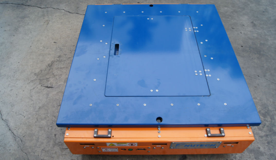 Top view of of Nutech Pallet Shuttle, showing a window for immediate and easy access to batteries. Pallet Shuttle is also known as Radio Shuttle, Pallet Carrier, Orbiter, and Shuttle Car.